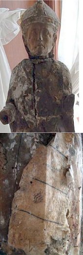 Trozo del códice y la estatuilla del siglo XVI de un obispo donde fue hallado